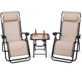 A pair of reclining chairs with a small table featuring a bottle of wine, perfect for a leisurely evening.